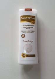 Lait embellissant hydratant clarifiant SECRET DE TEINT teint bronzé pour tous types de peaux